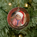 Baby’s First Christmas Vintage Red Snowflake Ceramic Ornament<br><div class="desc">Commemorate a baby's first Christmas personalized with two photos on this double-sided keepsake ornament featuring a vintage red background with snowflakes and multi-colored stars and your custom text on both sides. Change or delete the text as desired. The text font style, size and color can be changed by clicking on...</div>