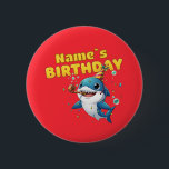 Baby Shark 2 Inch Round Button<br><div class="desc">Make a splash at your little one's birthday party with this adorable Baby Shark design! Featuring a cheerful blue shark wearing a festive party hat and blowing a noisemaker, surrounded by colorful confetti and bubbles. This vibrant, high-quality illustration is perfect for first birthdays, "One-derful" ocean-themed parties, or any toddler who...</div>