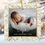 Babys 1st Christmas Photo Gold Foliage White Ceramic Ornament<br><div class="desc">Celebrate baby's first Christmas with this beautiful keepsake ornament. Easily replace the sample image with your own favourite photo and customize it with baby's name in white script font and the year below. A black gradient screen helps make the text pop. The photo is set off by an elegant square...</div>