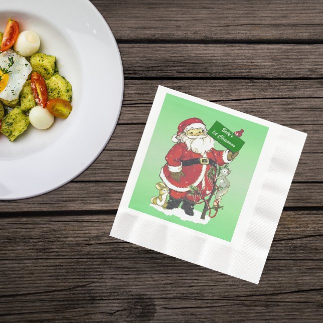 Baby's First Christmas Cute Santa Sign Napkin (Cute Santa Clause with tree little forest animals in snow on green Christmas paper napkins.)