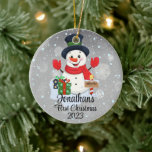 Baby's First Christmas cute snowman black hat  Ceramic Ornament<br><div class="desc">A whimsical Christmas tree ornament featuring an adorable snowman surrounded by delicate snowflakes. Customize it with your child's name and the year for a personalized touch that captures the joy of the season.
Use the "Personalize" button to customize to your liking.</div>