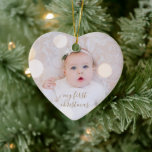 Baby's First Christmas Photo Ceramic Ornament<br><div class="desc">Your favourite photo on a heart shaped ceramic ornament. Upload your own image to create Christmas tree ornaments for yourself or give as a gift to family,  friends,  parents and grandparents!</div>