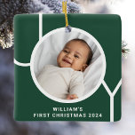 Baby's First Christmas Photo Keepsake Green Ceramic Ornament<br><div class="desc">This stylish Baby's First Christmas Photo Ornament is decorated with the word JOY in modern typography on a pine green background.
Easily customizable with your photo,  name,  and year.
Makes a special gift for grandparents,  aunts,  and uncles.</div>