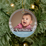 Baby's First Christmas Photo Light Blue Ceramic Ornament<br><div class="desc">This keepsake Christmas ornament features a photo of baby and is framed with light blue and is accented with white snowflakes.  White script text reads: My First Christmas. Custom text allows you to personalize with baby's name and year.</div>