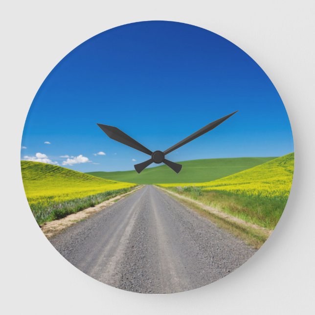 Backcountry road through Spring Canola Fields Large Clock (Front)