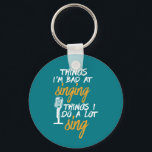 Bad At Singing Funny Karaoke Singer Artist Keychain<br><div class="desc">I'm Bad At Singing Love To Sing. Funny design for those who love to sing on stage, in the shower, choir or musical, lead vocalist in music band. Cool humourous merchandise for musician, artist, singer songwriter and rock band member. Perfect for karaoke night and audition. Great Christmas gift and birthday...</div>