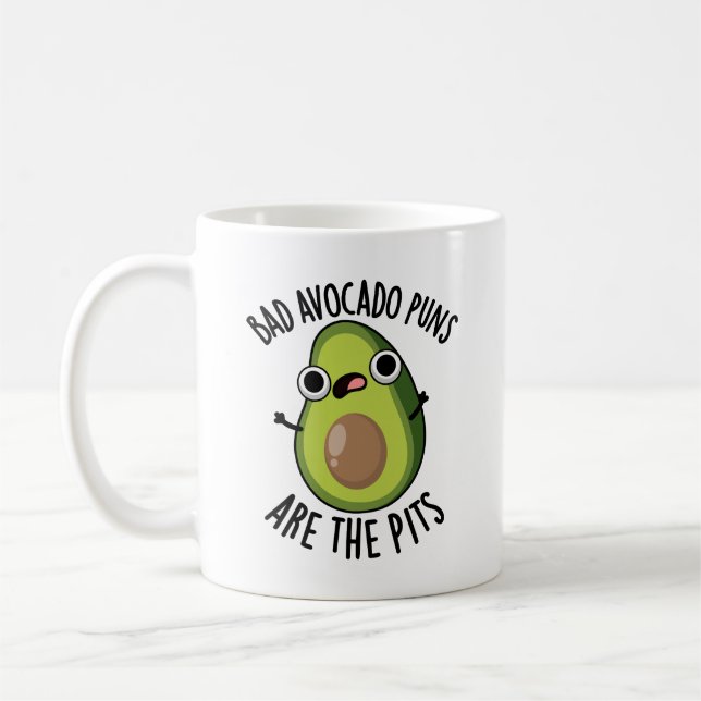 Bad Avocado Puns Are The Pits Funny Fruit Pun  Coffee Mug (Left)