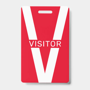 badge de visiteur en forme de lettre V géante