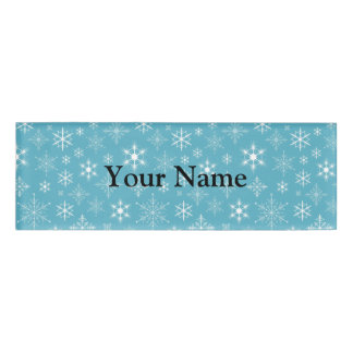 Badge D'identification Flocons de neige sur l'arrière - plan bleu