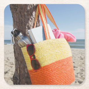 Bag Hanging On Tree Trunk At Sandy Beach Square Paper Coaster