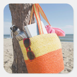 Bag Hanging On Tree Trunk At Sandy Beach Square Sticker