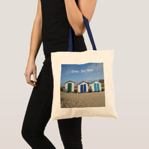 bag with beach huts blue sky sand english seaside