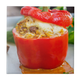Baked stuffed peppers with meat sauce and cheese tile