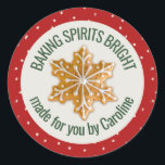 Baking Spirits Bright | Gingerbread Cookie Custom Classic Round Sticker<br><div class="desc">Add an extra touch to your holiday baking with these custom labels. A cream circle is centred over a Christmas red background that is scattered with hand-sketched falling snow. Centred in the middle is a decorated snowflake gingerbread cookie. Personalize the design by customizing the text using the provided templates. Perfect...</div>