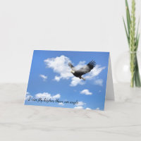 Bald Eagle flying in clouds