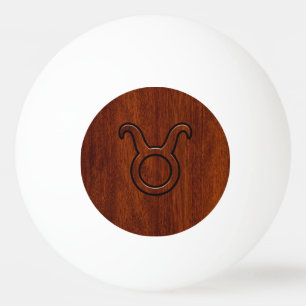Balle De Ping Pong Symbole Taurus Zodiac sur le Décor en acajou