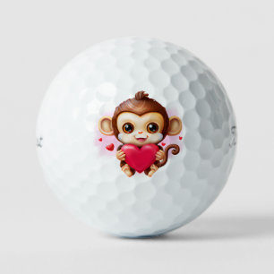 Balles De Golf Bébé adorable singe tenant un coeur rouge