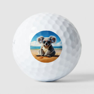 Balles De Golf Koala sur une plage de sable