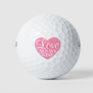 Balles de golf rose et blanc L'amour gagne toujour
