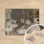 Ballet Rehearsal on Stage | Edgar Degas Jigsaw Puzzle<br><div class="desc">Ballet Rehearsal on Stage (1874) | Edgar Degas’s Ballet Rehearsal on Stage captures an intimate behind-the-scenes moment of ballet dancers preparing for a performance. The composition features dancers stretching, practicing poses, and engaging in casual conversation, set against a shadowy stage backdrop. Degas’s masterful use of pastel colors and dynamic perspective...</div>