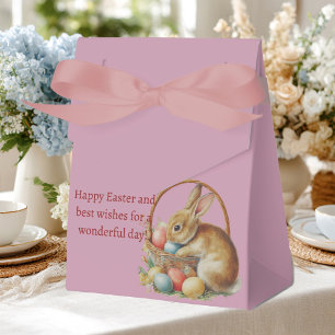 Ballotins Pâques, lapins et œufs colorés dans un panier en o