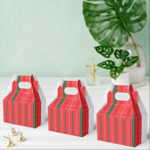 Ballotins Une pomme rouge vif est posée sur une surface blan