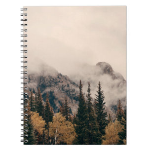 Banff national park foggy mountains and forest in  notebook