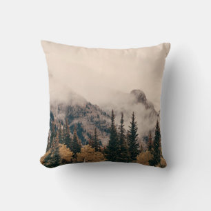 Banff national park foggy mountains and forest in  throw pillow