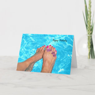 Bare feet with flowers in pool card