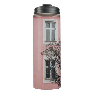 BARE TREE IN FRONT OF PINK BUILDING THERMAL TUMBLER