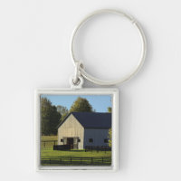 Barn on thoroughbred horse farm at sunrise,