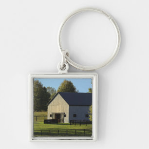 Barn on thoroughbred horse farm at sunrise, keychain