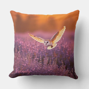 Barn owl flying at sunrise over a Lavender meadow Throw Pillow