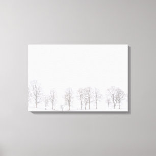 Barren trees in winter in snow white world canvas