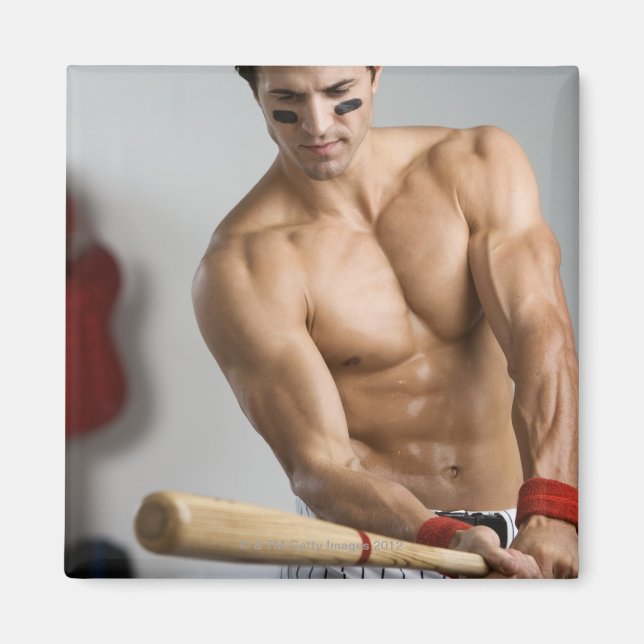 Baseball player with bare chest warming up with magnet (Front)