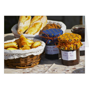 Basket with croissants and chocolate breads.