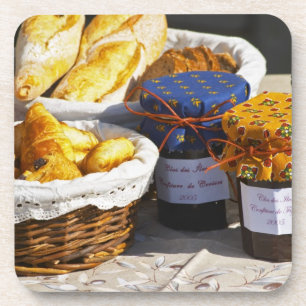 Basket with croissants and chocolate breads. coaster
