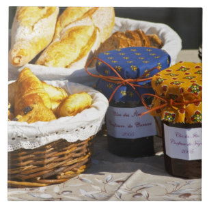Basket with croissants and chocolate breads. tile