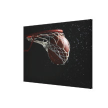 Basketball going through hoop 2 canvas prints