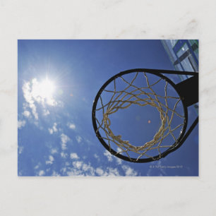 Basketball Hoop and the Sun, against blue sky Postcard