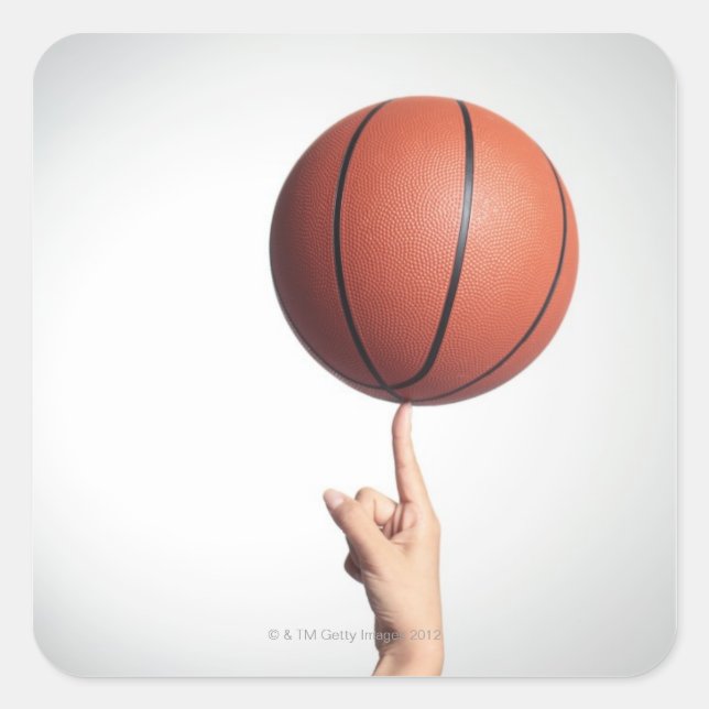Basketball on index finger,hands close-up square sticker (Front)