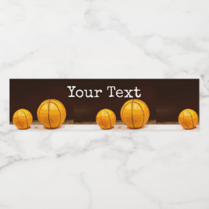 Basketballs are on black background Glass Water Bottle Label