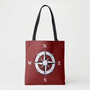 Bateau noir nautique, boussole, sac à main rouge