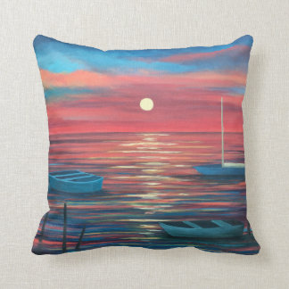 Bateaux à coussin d'accentuation au coucher du sol