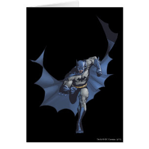 Batman runs with flying cape