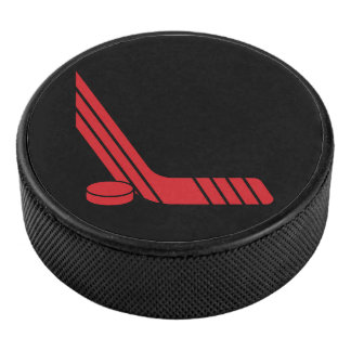 Bâton de hockey rouge minimal et palet