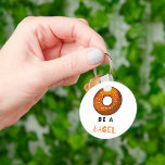 Be a Bagel Funny Food Pun Bagel Lover Design  Keychain<br><div class="desc">Carry a little humor with you wherever you go with this “Be a Bagel” keychain. Featuring a fun bagel illustration and a playful pun, this keychain is perfect for food lovers, brunch enthusiasts, and anyone who enjoys a good joke. Lightweight and durable, it’s a great way to personalize your keys,...</div>