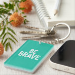 Be brave simple motivational quote keychain<br><div class="desc">Bold white be brave simple motivational quote playful typography in turquoise solid background design.</div>