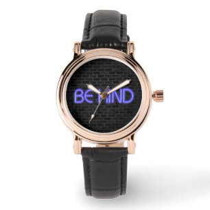 BE KIND text in neon lighting on brick Watch