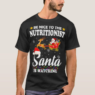 Be Nice To The Nutritionist Santa Watching Xmas T-Shirt